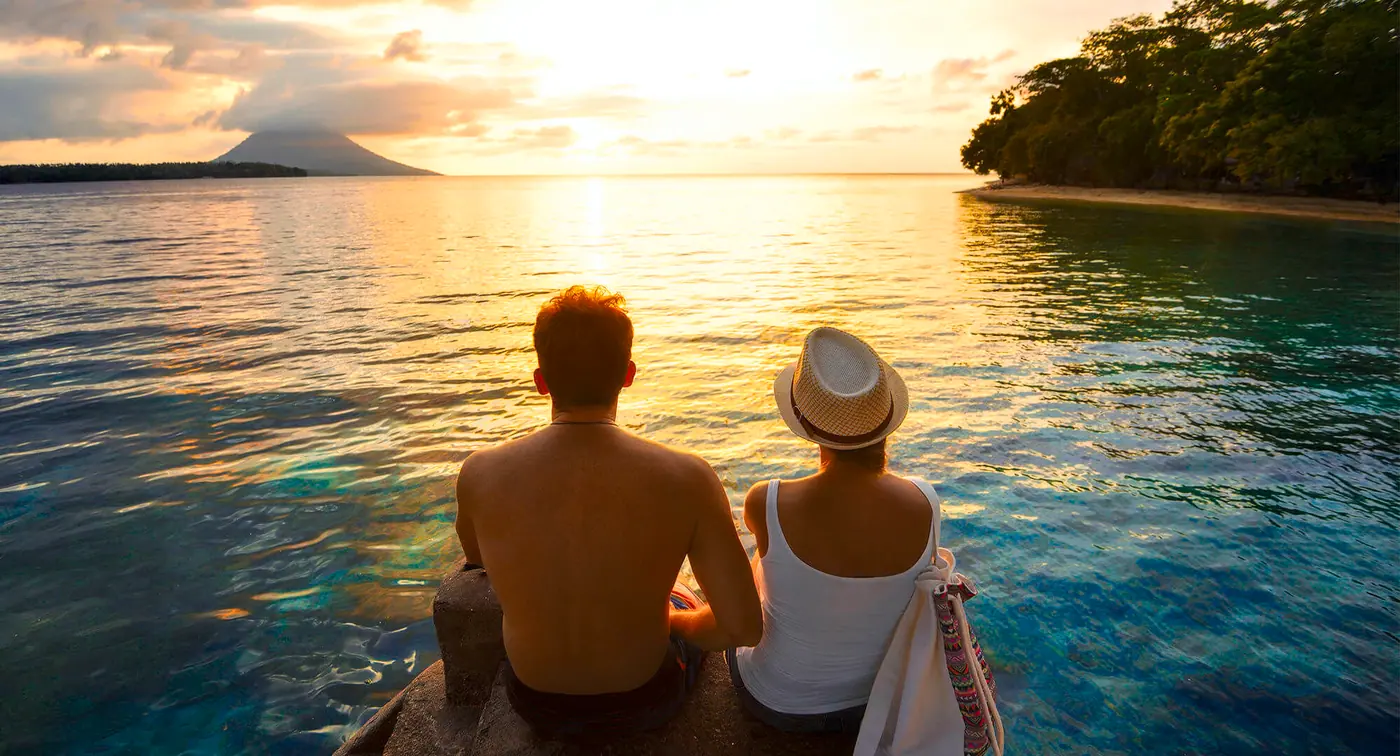 Couple watching sunset over the water together — Marathon Couples Counselling